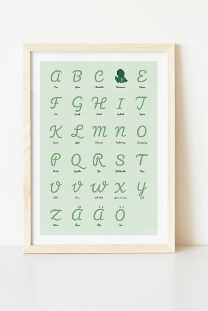 Grön ABC-poster med dinosaurie i träram